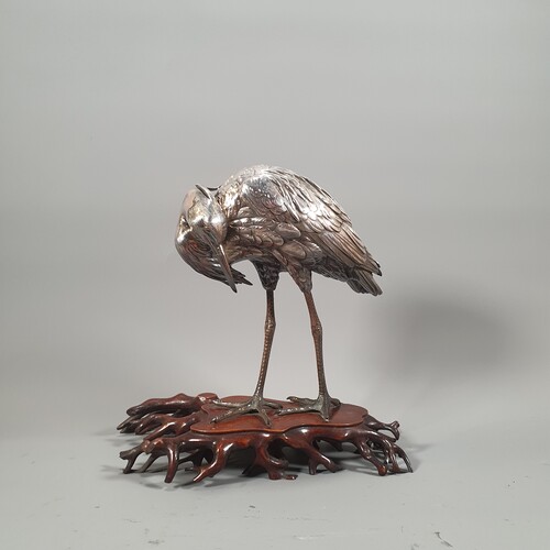 A Japanese silver okimono of an egret, meiji period. Marked Height 26cm to 27cm