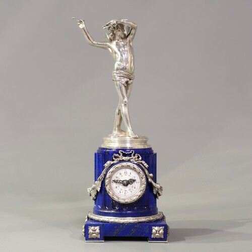 A rare 19th century small clock with silver cupidon figure and lapis lazuli plinth. Signed Moreau Vauthier for Augustin Edme MOREAU-VAUTHIER (1831-1893)