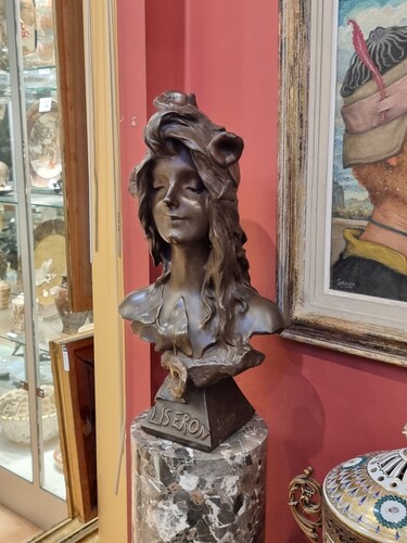 bronze bust of a women